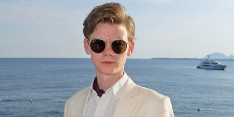 Thomas Brodie-Sangster was seen wearing gold Ray-Ban RB 3647N 001/57 round sunglasses with brown Polarised lenses at the Gentleman's Journal and Chopard "Road To Cannes" dinner during the 72nd International Cannes Film Festival