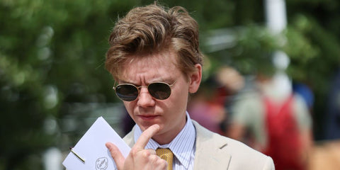 Thomas Brodie-Sangster was seen wearing arista Ray-Ban Round Metal RB 3447N 001 sunglasses at the Cartier Style Et Luxe event during Goodwood Festival of Speed 2024