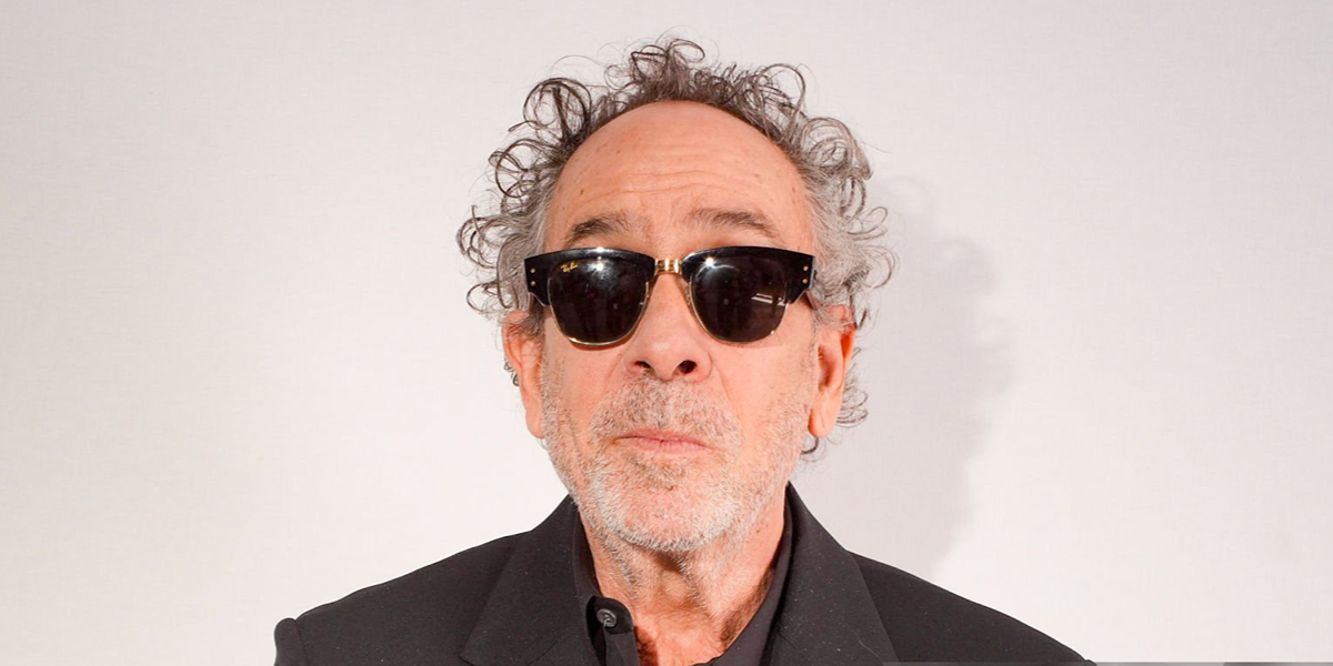 Tim Burton wore black ASAP Rocky Blacked Out Collection Ray-Ban Mega Clubmaster RB 0316S 6826/J5 sunglasses at the Loewe Spring Summer 2027 show during Paris Fashion Week.