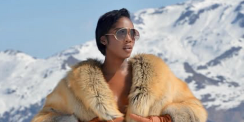 Tiwa Savage was seen wearing gold Loewe Signature LW40180U 30F oversized sunglasses with brown gradient lenses in Courchevel, April 2025.