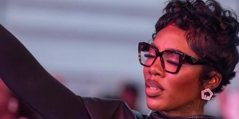 Tiwa Savage was seen wearing tortoise Prada PR 09ZV 2AU1O1 square optical glasses in her Instagram post, June 2026.