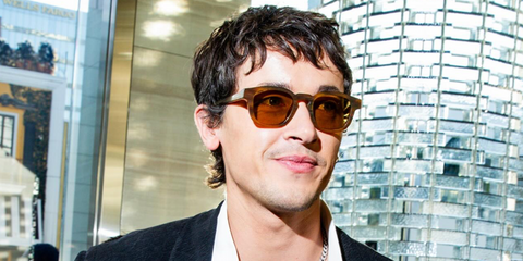 Tom Blyth was seen wearing striped tortoise Giorgio Armani AR8254U 6163/73 sunglasses at the Giorgio Armani Pre-Oscars party in Los Angeles, March 2026.
