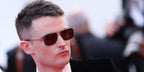 Tom Sturridge was seen wearing silver and black Saint Laurent Sun SL 417 001 sunglasses at the screening of L'Innocent during Cannes Film Festival 2022