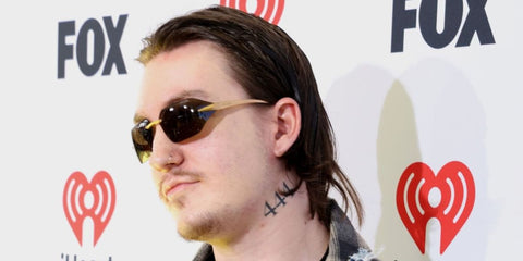 Tommy Richman was seen wearing gold Prada PR A56S 15N5S0 sunglasses at the iHeartRadio Music Awards 2024 in Los Angeles. Shop online now on Pretavoir