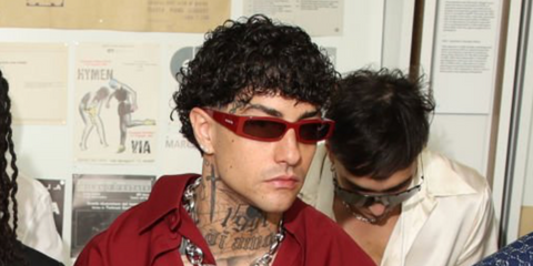 Italian rapper Tony Effe was seen wearing red Gucci GG1778S 003 sunglasses at the Gucci Menswear Spring/Summer 2025 fashion show during Milan Men's Fashion Week.
