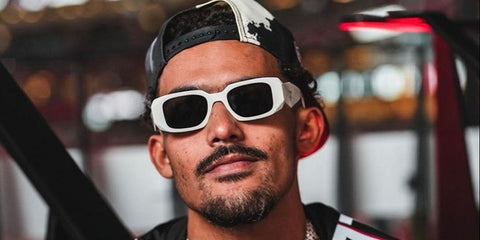 Basketball player Trae Young of the Washington Wizards was seen wearing white Prada PR 17WS 1425S0 Symbole sunglasses.