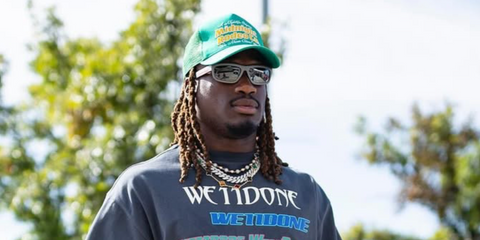 American football player Tremon Smith of the Houston Texans was seen wearing grey metal Prada Linea Rossa SPS 05Z 16X7W1 sunglasses in his Instagram post, October 2025.