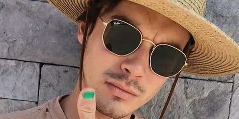 Actor Tyler Blackburn was seen wearing Ray-Ban RB 3548N 001 Hexagonal Gold With Flat Lenses sunglasses in a Teen Vogue feature.