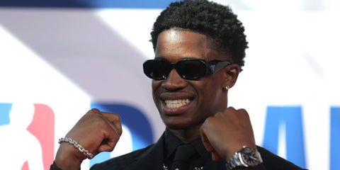 Basketball player V.J. Edgecombe was seen wearing black Prada PR 17WS 1AB5S0 Symbole Sunglasses at the 2025 NBA Draft. Shop online now on Pretavoir