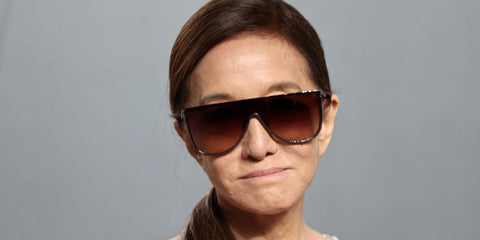 Fashion designer Vera Wang was seen wearing ruthenium Alaia AA0094S 005 mask sunglasses with brown gradient lenses at the 2026 Vanity Fair Oscars Party in Los Angeles.