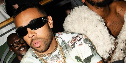 American rapper Vic Mensa was seen wearing black Versace 4446 GB1/87 wraparound sunglasses during Paris Men's Fashion Week season Spring/Summer 2025.