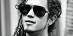 Dominican singer-songwriter Vicente Garcia was seen wearing black Ray-Ban RB 4376 601/71 sunglasses with polarised lenses. Shop online now on Pretavoir