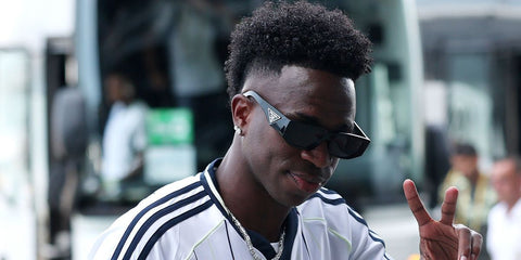 Brazilian footballer Vinicius Junior was seen wearing black Prada PR 09ZS 1AB5S0 sunglasses with dark grey lenses at the FIFA Club World Cup 2025 quarter final match. Shop online now on Pretavoir
