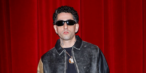 Rapper Wayne Santana was seen wearing black Oakley Fives Squared OO9238 10 sunglasses at the PDF Menswear Fall/Winter 2026 fashion show during Milan Men's Fashion Week