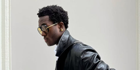 Model, stylist, and content creator Wisdom Kaye was seen wearing black Bottega Veneta BV1273S 003 Drop Aviator sunglasses with yellow lenses in his Instagram post, September 2024. Shop online now on Pretavoir