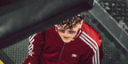 Mexican-American singer Xavi was seen wearing silver Cartier CT0550S 003 rimless sunglasses with blue to pink gradient lenses in a paid partnership post with Adidas and JD Sports on Instagram, in July 2025. Shop online now on Pretavoir