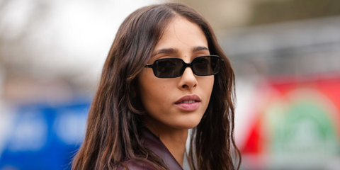 Yasmin Wijnaldum was seen wearing black Miu Miu Regard MU 11ZS 16K5S0 sunglasses during Paris Fashion Week Fall/Winter 2025 season