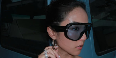 Singaporean fashion and creative force Yoyo Cao was seen wearing black Tom Ford Rellen TF1093 01V sunglasses with blue Photochromic lenses in her Instagram post, August 2024.