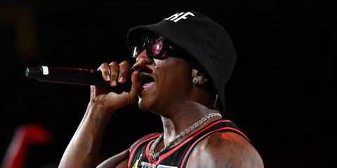 Rapper Yung Joc was seen wearing black Loewe x Paula's Ibiza LW40064U 01Y sunglasses with red lenses while performing during a timeout game between  between the New York Knicks and the Atlanta Hawks in April 2026.