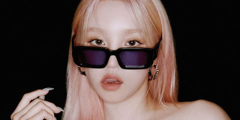 Chinese singer Yuqi Song of K-Pop group (G)I-DLE was seen wearing black Prada PR 06YS 16K10L sunglasses in an Elle Korea magazine feature