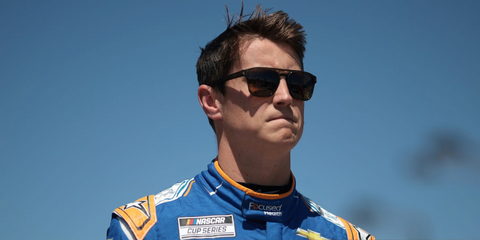 Zane Smith was seen wearing transparent olive green Oakley Latch Beta OO9436 03 sunglasses with Prizm brown lenses during qualifying for the the NASCAR Cup Series Goodyear 400 in Darlington, South Carolina, May 2024