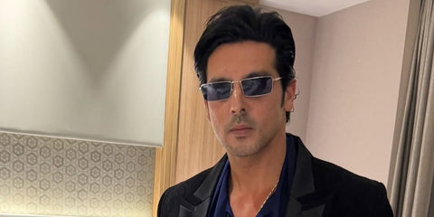 Bollywood actor Zayed Khan was seen wearing silver Ray-Ban Emy RB 3741 003/80 rectangular sunglasses with blue lenses in his Instagram post, May 2025. Shop online now on Pretavoir