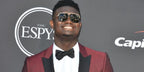 Zion Williamson was seen wearing black and gold Gucci GG0200S 001 aviator sunglasses to accept his winning the ESPY for best college athlete for his time at Duke University
