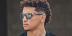 NFL player Patrick Mahomes wearing square black Oakley sunglasses