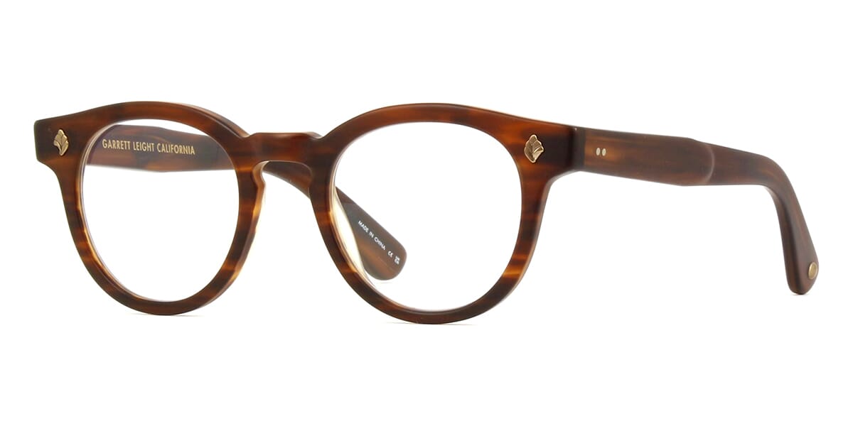 Three quarter view of amber coloured thick frame eyeglasses